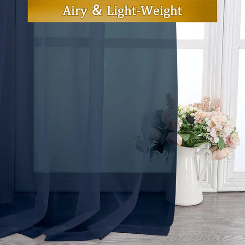 Close-up of navy blue semi-sheer voile curtains showcasing fabric texture with a floral vase near window, Pure Sheer Window Curtains 72 Inch Long 2 Panels Navy Blue Voile Drapes For Bedroom And Living Room Semi Sheer Rod Pocket Curtains 40 Inch Wide Each Total 80 Inches Width For Patio Yard Villa Parlor Cozy Window Treatments.