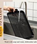 Heavy Duty Stainless Steel Grill Tray Set 3 Pack Nonstick Perforated Grill Baskets With Handles being washed under tap