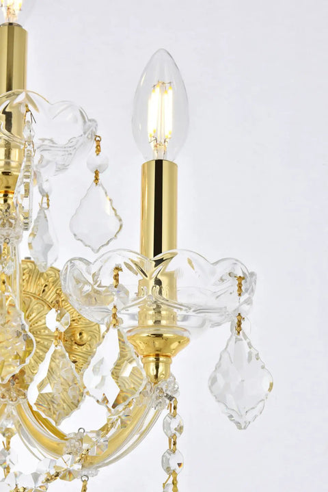 Close-up of Royal Cut Clear Maria Theresa 3 Light Crystal Wall Sconce with gold elements and candelabra bulb detail in chrome finish