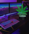 3D Illusion Night Light With Remote, 16 Color Changing LED Lamp on desk with green leaf design, ideal for modern decor