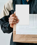 Person holding 160 Sheets 4x6 Inch Waterproof Synthetic Paper Shipping Labels with document.
