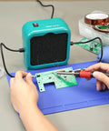 Sweet Compact Soldering Fume Extractor With Flexible Helping Hands and Heavy Duty Activated Carbon Filters in use during PCB repair.