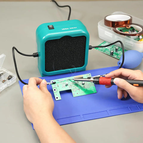 Sweet Compact Soldering Fume Extractor With Flexible Helping Hands and Heavy Duty Activated Carbon Filters in use during PCB repair.