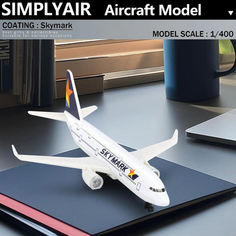 Skymark 1 By 400 Airplane Model Kit For Display with alloy body and plastic base on desk, 5.6 inch length, 1/400 scale