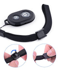 Two Pack Wireless Phone Camera Remote Shutter For iPhone And Android With Wrist Strap, close-up showing strap adjustment