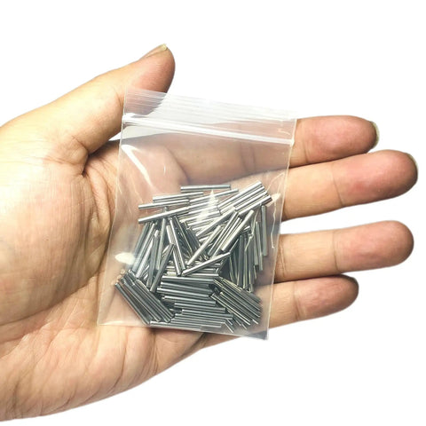 Heavy Duty 304 Stainless Steel Dowel Pins 2Mm X 18Mm Precision Ground Metal Shelf Pegs 110 Pack in a clear bag held in hand.