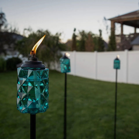 Topaz Blue Glass Outdoor Torches Two Pack, 65 Inch Weather Resistant Patio Lanterns for backyard and garden, with fiberglass wick.