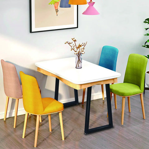 Dining table with 36 Inch Metal Table Bar Legs Heavy Duty Beefy Industrial Style, surrounded by colorful chairs.