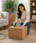 Person sealing 12 By 8 By 10 Inches Corrugated Cardboard Shipping Boxes 30 Pack for Packing Mailing Storage And Moving Needs at home