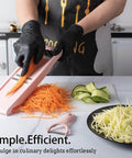 Pink NACOLUS 5-in-1 mandoline slicer for vegetables being used to julienne carrot strips on a kitchen counter