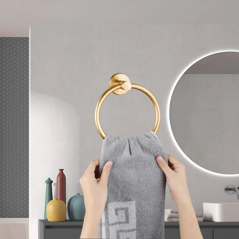 Slick Wall Mounted Towel Ring Crafted From Premium Stainless Steel Tailored For Top Shelf Bathrooms And Kitchens Boasts A Butter Smooth Swivel Handle With Quick Screw Install That Totally Slaps Against Tile Work, showing a hand placing a towel.