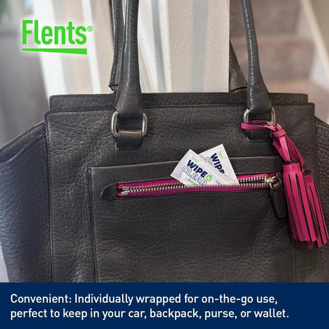 Flents lens wipes, Wipe N Clear Basic, individually wrapped; two packs show in a black leather bag pocket.