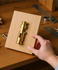 Brass Hidden Barrel Hinges Set For Cabinets And Furniture displayed on wood surface with tools, showcasing design and use