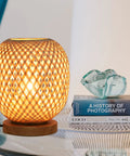 Dimmable Rattan Table Lamp With Bamboo Woven Shade, Boho Wicker Desk Light, emitting warm glow, 8 inch, wooden base, on table