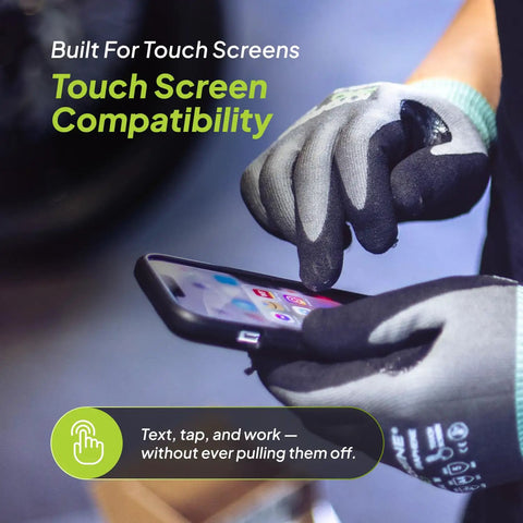 Cut Resistant Work Gloves 00-840 ANSI A4 Graphene Nitrile Coated in use, showing touchscreen compatibility while holding a smartphone.