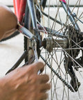 Hand installing a Six Seven Eight Speed Bike Chain For Road Mountain And BMX Riders Half By Three Thirty Second Inch 116 Links