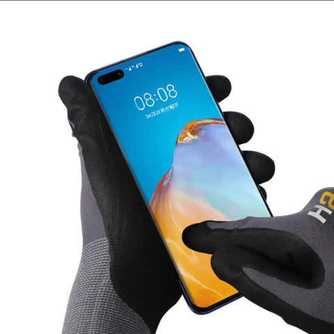 Using a smartphone with Micro Foam Nitrile Work Gloves With Spandex Liner For Ultra Grip And Breathable Oil Friendly Wear Nitrile Coated Handwear