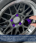Glossy purple 20 Pack Lug Nut Covers 19mm Hex With Removal Tool fitted on vehicle wheel, showing installation process.