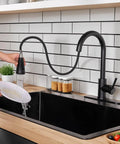 Hella Sweet Matte Black Kitchen Faucet With Single Handle And Buttery Pull Down Sprayer Solid Stainless Steel in use over black sink