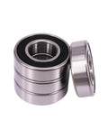 10 Pcs 6200-2RS deep groove ball bearings with dual rubber seals 10x30x9mm, shown with bearings stacked and one lying on side