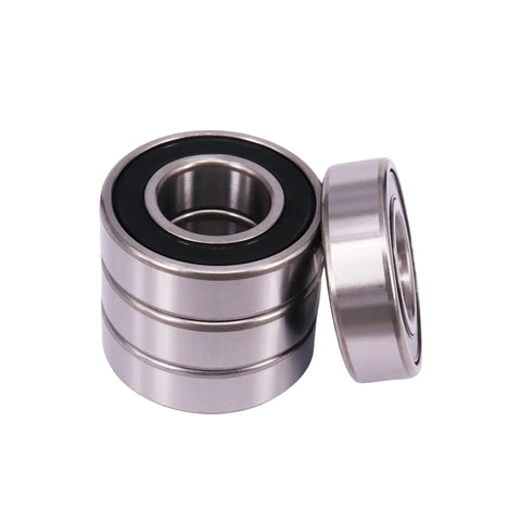 10 Pcs 6200-2RS deep groove ball bearings with dual rubber seals 10x30x9mm, shown with bearings stacked and one lying on side