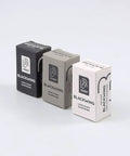 Two Step Long Point Pencil Sharpener With German Steel Blades In White Matte Finish boxes displayed on a surface