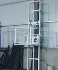 Badass Heavy Duty Electric Freight Elevator, Steel Guide Rail Lift Platform, 500 Kg Vertical Hauler, hoist in industrial setting.