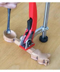 20mm Quick Press Hold Down Clamp With Ratchet Locking Mechanism used on woodworking project, aluminum body, close-up view.