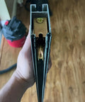 Side view of a Sliding Patio Door Roller Assembly with 1-1/8 inch steel wheel in track housing, dichromate finish for doors.