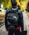 Man wearing Dark Storm Castle Crow Printed Unisex Backpack With Large Capacity Durable Polyester in park