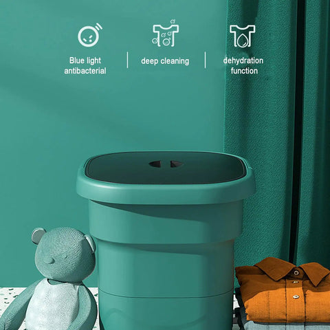 Slick Portable Washing Machine With Hella Compact Folding Build That Is A Real Deal For Camping Trips And Dorm Rooms Featuring Lightweight 24 Liter Spin Cycle For Delicates And Gear next to a teddy bear.