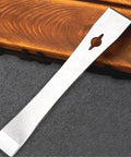 Beefy Stainless Steel Crowbars Set With Flat Head Pry Bars And Scrapers shown on wooden surface