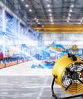 Heavy Duty Industrial Floor Drum Fan Rock Solid Steel Frame Kickin High Speed Airflow For Garage Workshop Jobsite And Warehouse Summer Cooling Operations in large warehouse.