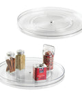 14.5 Inch Lazy Susan Organizer Set Of 2 Large Turntables For Cabinets Or Pantries With Smooth Ball Bearing Rotation And Easy Grab And Go Access, Clear See Through with spices on display.