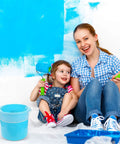 Mother and daughter painting with a bucket using 10 Pcs Paint Filter Strainer Bags White Fine Mesh For 5 Gallon Buckets Elastic Top Disposable Filter Bags for Painting No Mess Staining, Gardening And Plant Protection 250 Micron Mesh on floor.