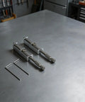 Super Cool Spring Loaded Screwdriver Bit Extension With Non Magnetic Grip For Slotted And Phillips Torx Bits In Silver on workbench