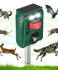 Outdoor Ultrasonic Pest Repeller With Motion Sensor And LED Strobe Lights, surrounded by animals, shown in garden setting
