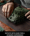 Hands assembling M4 Sherman Tank Building Kit For Adults, Realistic WW2 Military Model with Movable Front Section, 860 Pieces