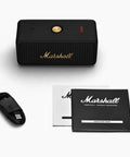 Emberton II Portable Bluetooth Speaker With 360 Degree True Stereophonic Sound, charging cable, and user manuals displayed