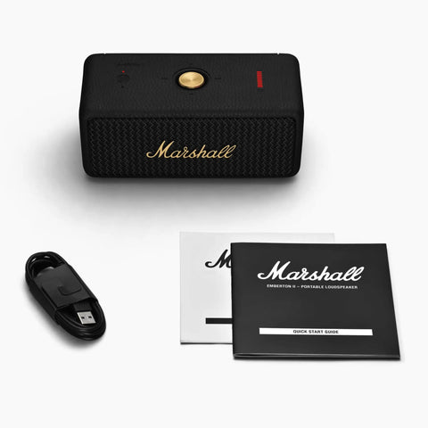 Emberton II Portable Bluetooth Speaker With 360 Degree True Stereophonic Sound, charging cable, and user manuals displayed
