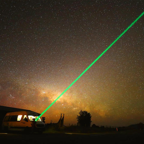 Night sky with green laser beam from Rechargeable Green Laser Pointer High Power Beast Long Range Beam for astronomy use.