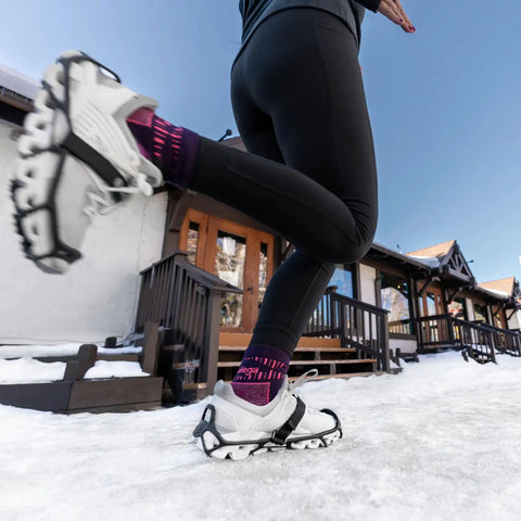 Heavy Duty Tungsten Carbide Spikes For Ice Walkers Large X Large Black Traction Cleats on snowy sidewalk with runner.