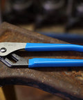 Two Piece Tongue And Groove Pliers Set 9.5 Inch And 12 Inch Slip Joint High Carbon Steel with blue rubber grips on rusty surface