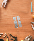 Metal 360 Degree Pivot Hinges for Doors and Cabinets, Heavy Duty, Fits 20 to 40mm Thickness, on a wooden surface with tools