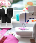 Zipper on a sewing table with sewing machine and colorful fabric, featuring Zipper Jig Tools Set Pro Grade Stainless Steel Quick Zipper Pull Tool With Sliders and Installation Jig for Repair 2 Piece Pack Includes 6 Screws Durable Metal Zipper Puller Kit For Easy Fixes.