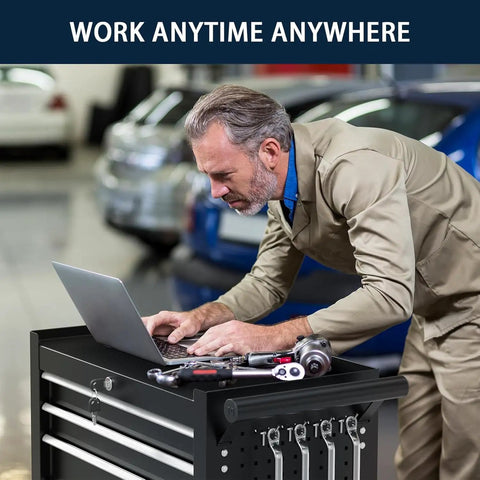 Man using laptop on 7-Drawer Rolling Tool Chest With Locking System, Beefy Heavy Duty Alloy Steel Cabinet On Wheels For Garage