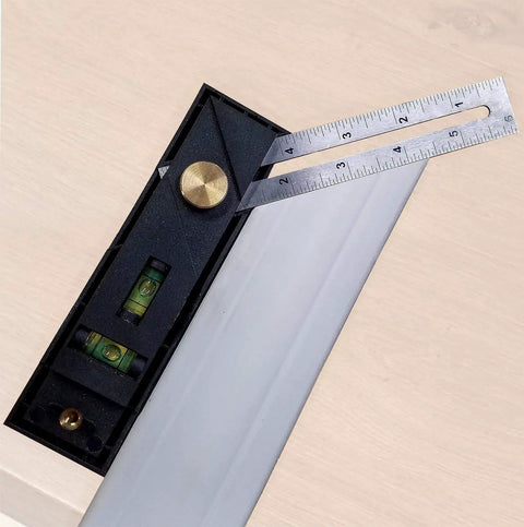 Close-up of Straight Shooter Nine In One Measuring And Marking Tool Featuring Dual Levels Sliding Bevel with depth gauge and ruler.