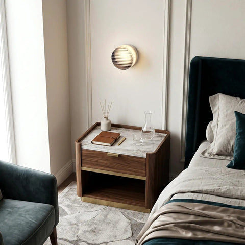 Modern Round LED Wall Sconce, 8W Smoke Grey Striped Glass Vanity Light above a stylish nightstand next to elegant bedding.