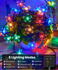60 LED Cherry Blossom Solar String Lights Outdoor Waterproof Fairy Lights on a plant with visible lighting modes