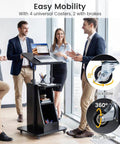 Slick Height Adjustable Standing Desk With Smooth Rolling Casters, Tilting Lectern Stand in modern office with professionals.
